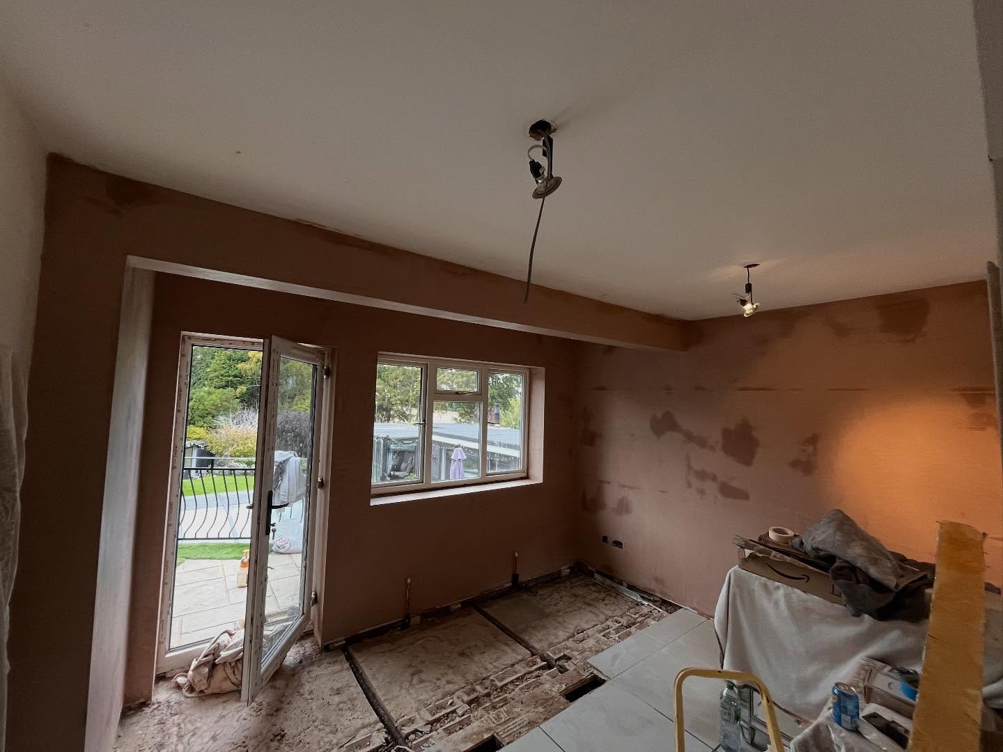 Gez Sayers finishing a plastered ceiling on a Southend property