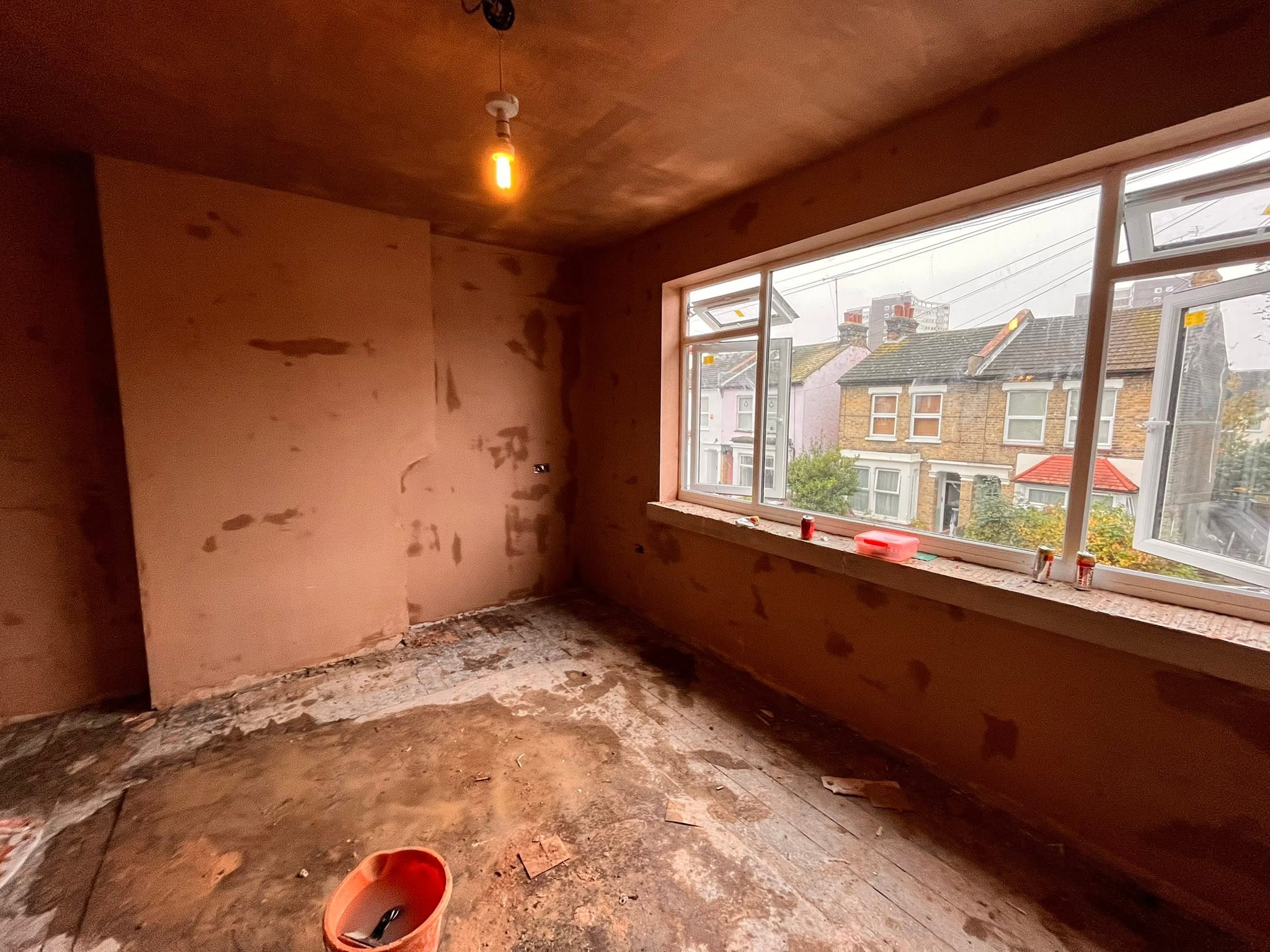 Freshly skimmed wall with a smooth plaster finish ready for decorating, Southend