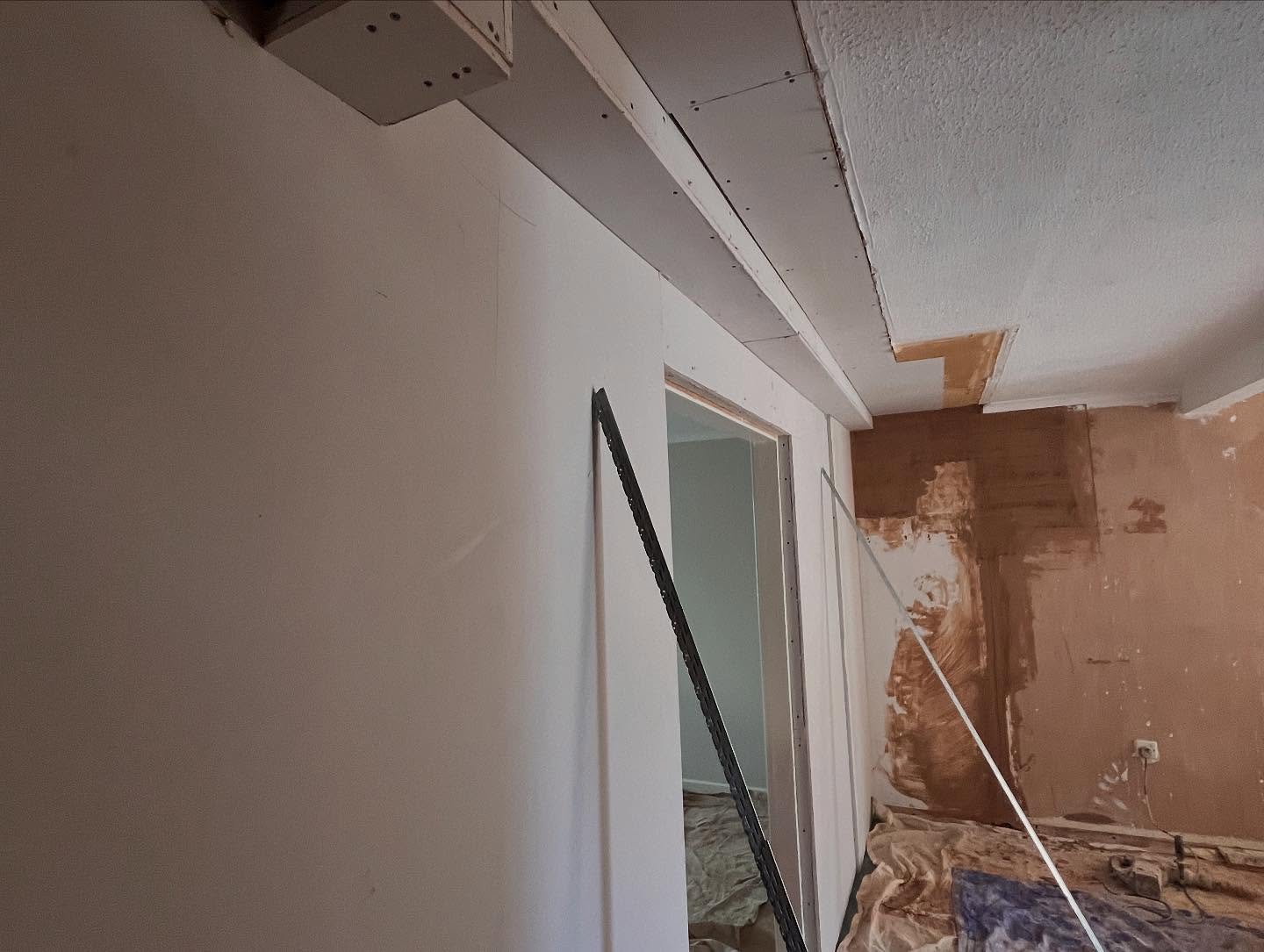 Plasterboard fitted to a stud wall ready for skimming, Southend Essex