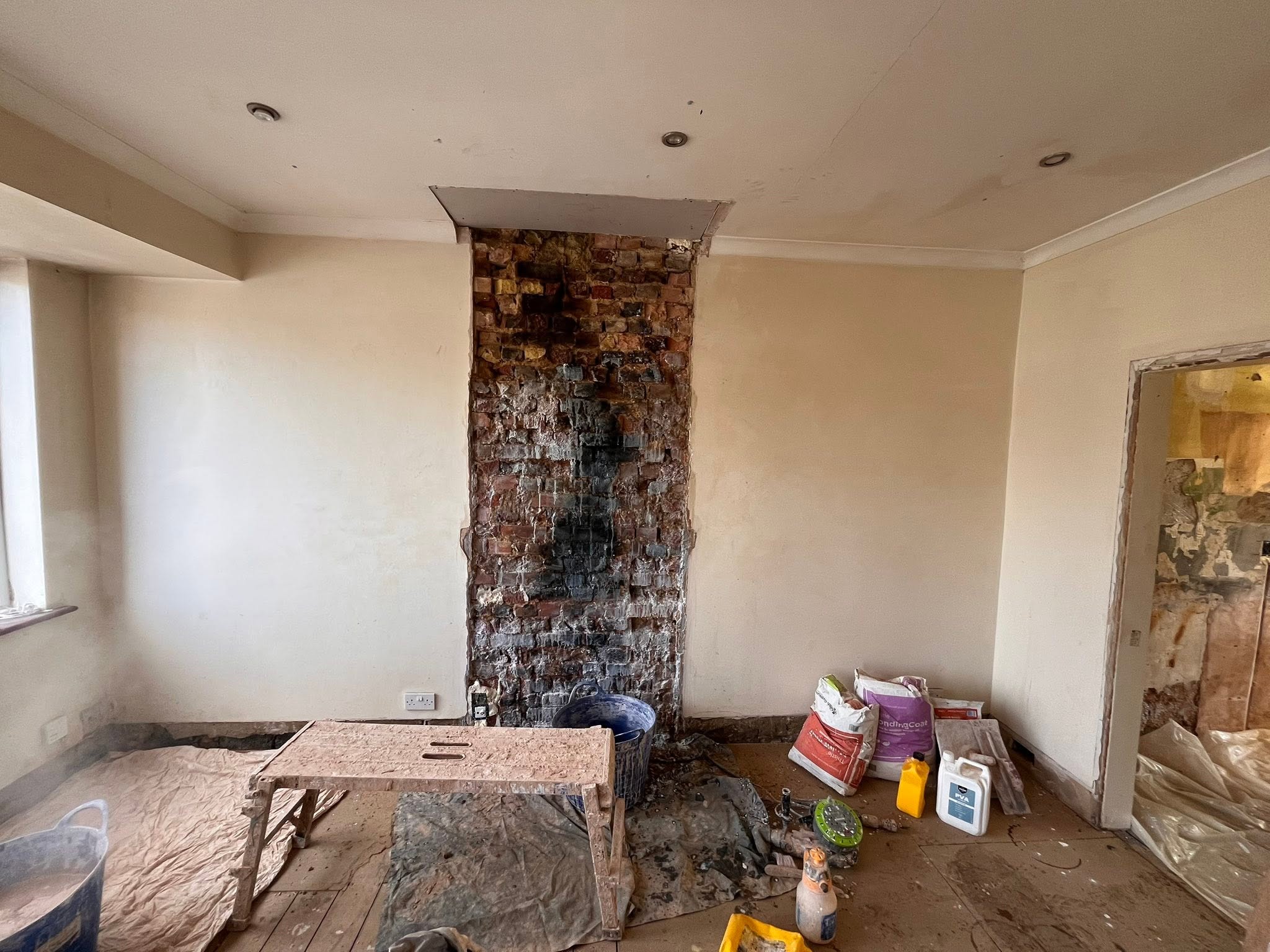 Bonding coat applied to an uneven wall before skimming on a Southend renovation